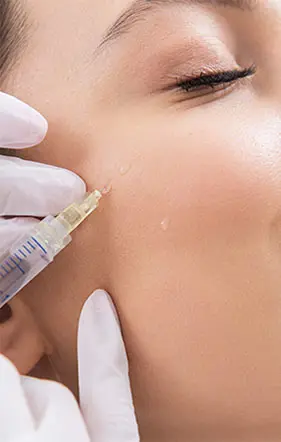 A woman is receiving the skin repair PDRN treatment by an esthetician